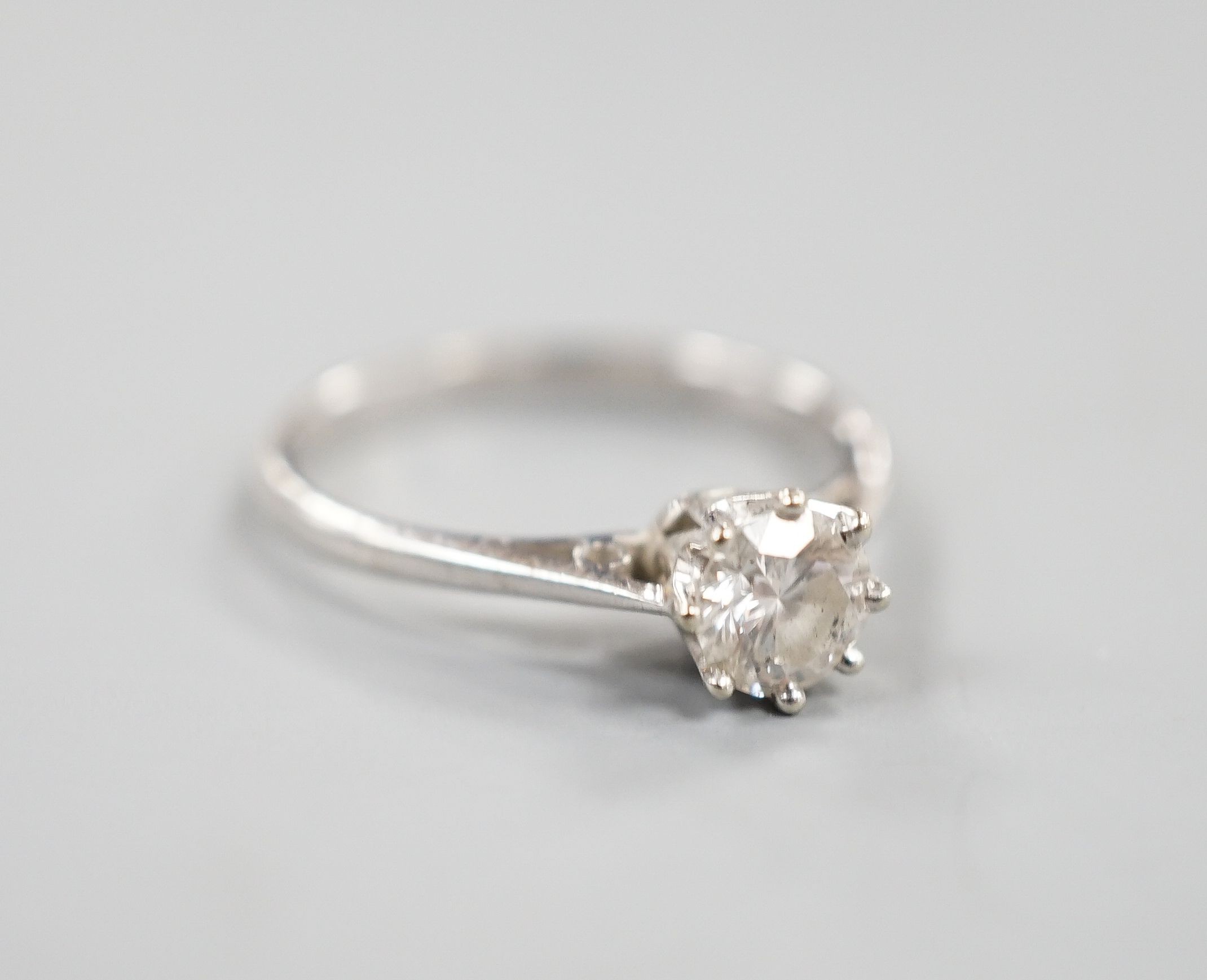 A modern 18ct white gold and solitaire diamond ring, size N, gross weight 2.2 grams, the stone measuring 5.2mm in diameter.